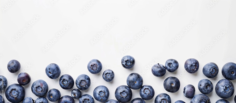 Aufkleber Blueberries arranged in a neat row on a white backdrop with ample copy space image