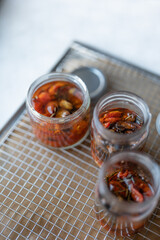 Roasted Tomatoes in Olive Oil,dry small tomatoes,cooking process,canned food,healthy home cooking,italian,spice,small tomato in an oven,colorful food,zen eating,diet