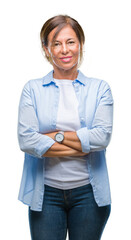 Middle age senior hispanic woman over isolated background with serious expression on face. Simple and natural looking at the camera.