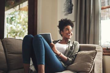 Thinking, home and black woman on sofa on tablet for social media, online shopping and internet....