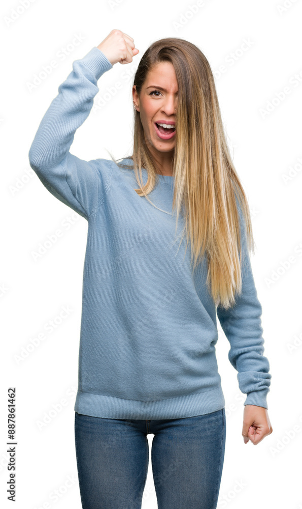 Poster beautiful young woman wearing sweater and jeans annoyed and frustrated shouting with anger, crazy an