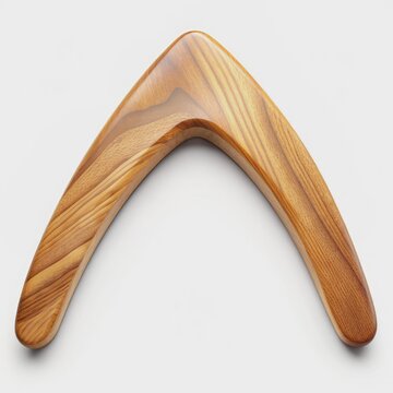 recommend clip art: Isolated wooden boomerang with a smooth curved shape and natural wood grain texture, perfectly cut out with a clipping path on a pure white background.