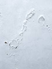 white wall with long round crack