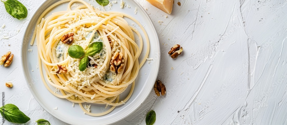 Poster italian homemade spaghetti in creamy blue cheese sauce with walnuts presented as a delicious vegetar