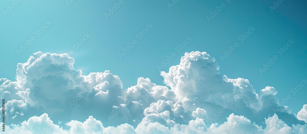 Poster background of a clear blue sky with fluffy white clouds suitable for copy space image