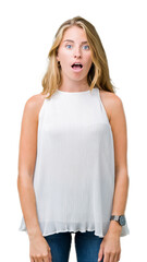 Fototapeta premium Beautiful young elegant woman over isolated background afraid and shocked with surprise expression, fear and excited face.