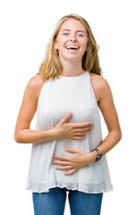 Fototapeta premium Beautiful young elegant woman over isolated background Smiling and laughing hard out loud because funny crazy joke. Happy expression.