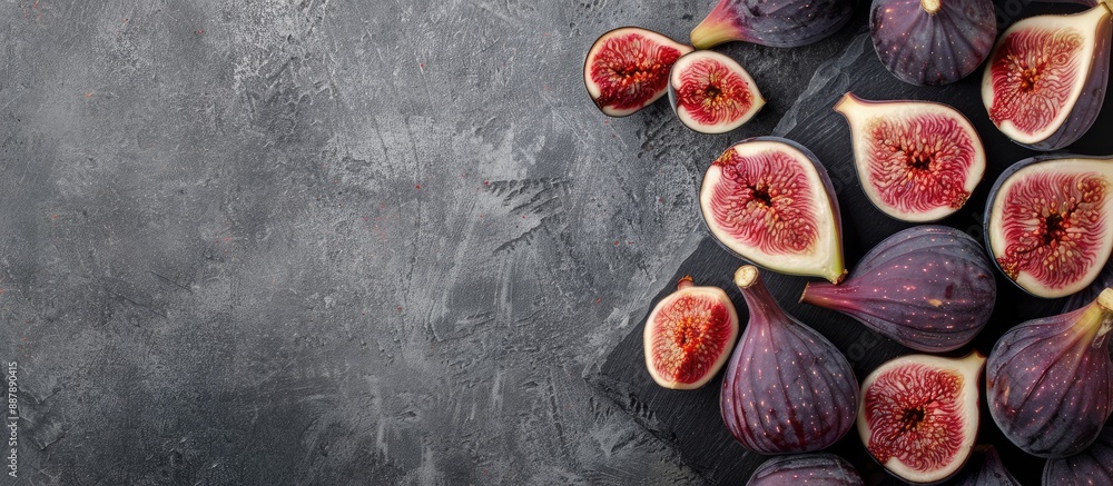 Poster an abundance of figs on a cutting board with some sliced all displayed in a copy space image