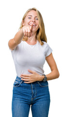 Beautiful young woman wearing casual white t-shirt over isolated background Laughing of you, pointing to the camera with finger hand over chest, shame expression