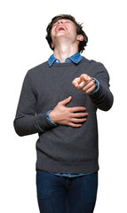 Young handsome elegant man over isolated background Laughing of you, pointing to the camera with...