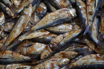Dried sardines are displayed and being sold on a dry fish market, Salted sardines are on sale at a local Asian seafood market, Closeup shot of freshly caught dried seafood