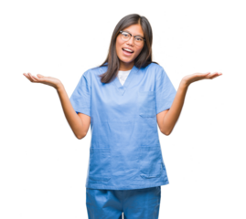 Young asian doctor woman over isolated background clueless and confused expression with arms and hands raised. Doubt concept.