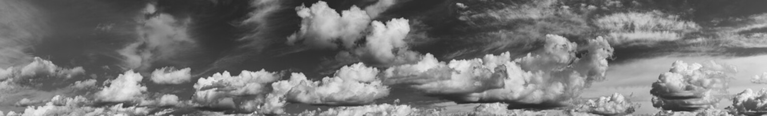 Panorama Of Cloudy Sky. Natural Day Cloudy Sky Abstract Background. Panorama Panoramic View. Backdrop. Copy Space. Black And White Colors