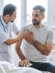 Obraz premium Physiotherapist examining shoulder joint of male patient and checks mobility of movements inside a clinic