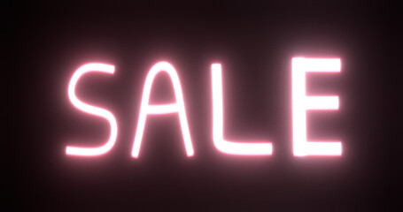 Sale neon text sign on black background.