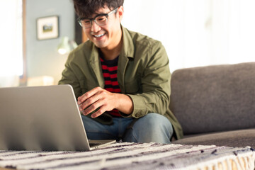 asian man work using computer hand typing laptop keyboard contact us.student study learning education online.adult professional people chatting search at office.concept for technology device business
