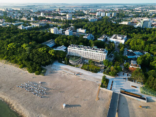 The photo showcases the charming town of Kołobrzeg, located on the shores of the Baltic Sea....