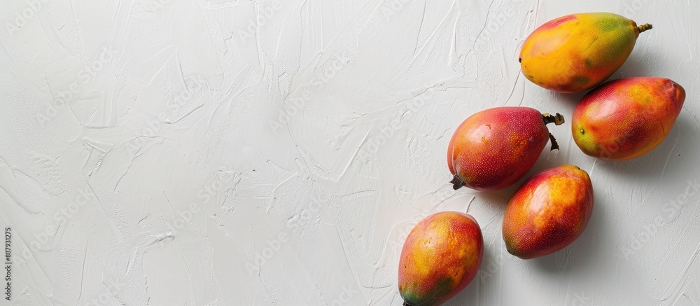 Poster mangos displayed against a white backdrop with copy space image