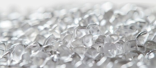 Copy space image of clear polypropylene or polyamide granules in the background typical of the plastics and polymers industry