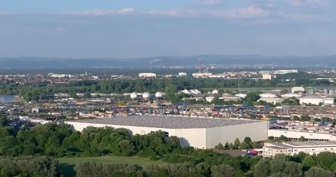 Drone pan over the German industrial city of Ludwigshafen with a large chemical plant during the day