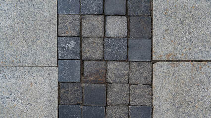 The paving slabs are square in shape. Square paving slabs