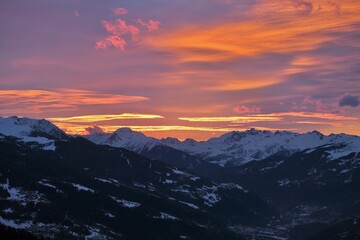 Breathtaking Sunset Over Snow-Capped Mountain Range