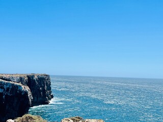 View of strong waves hitting the rock at Sagres, Algarve, Portugal.