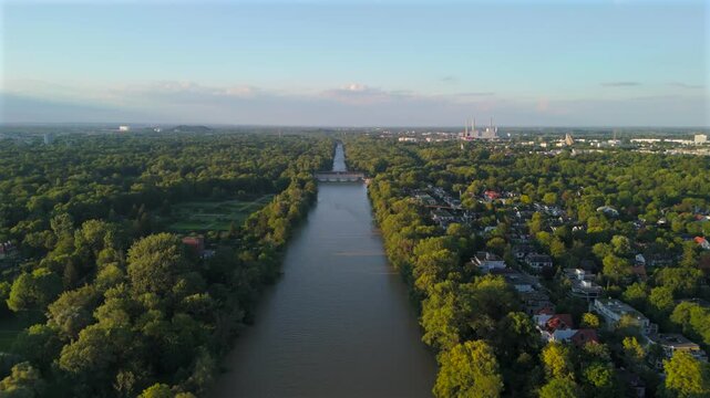 Stauwehr Oberfoehring Muenchen, Bayern, Deutschland Luftaufnahme im Sommer. Dam on Isar River in Munich, Germany aerial view in summer. Top view of the English Garden and the dam on the River Isar. 