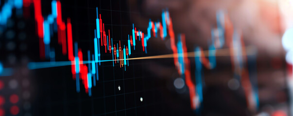 Close-up of stock market chart with fluctuating graphs, showcasing financial trends and investment analysis in a dynamic economy.