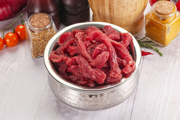 Raw beef meat - sliced strips