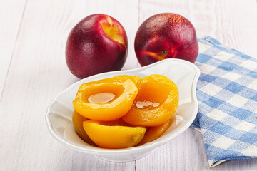 Canned peaches with sweet syrope
