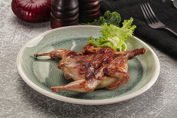 Grilled quail in the plate