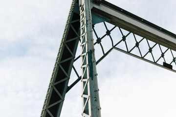 metal bridge with clouds in background