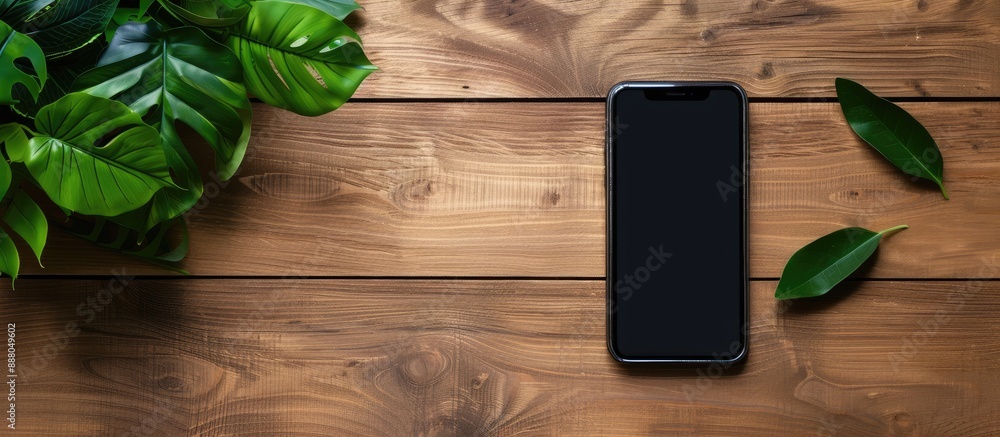 Poster smartphone on a wooden desk with a blank screen ideal for copy space image