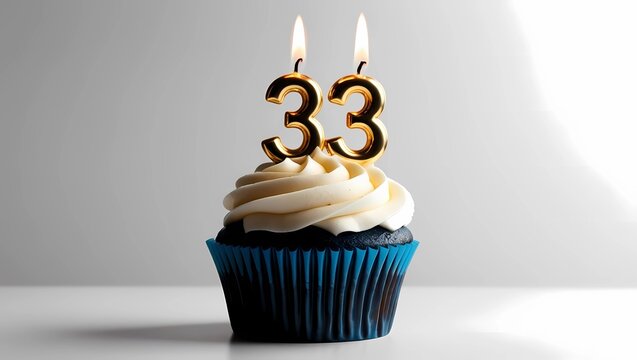 Gold Candle Number 33 on Blue Cupcake with Gray Background
