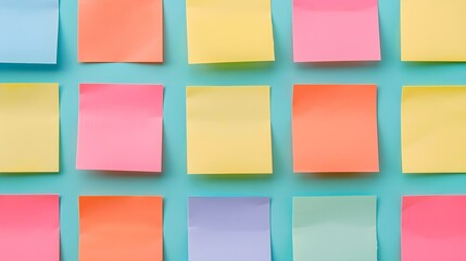 Colorful sticky notes arranged neatly on a pastel background, perfect for reminders and organization in a vibrant and playful setting