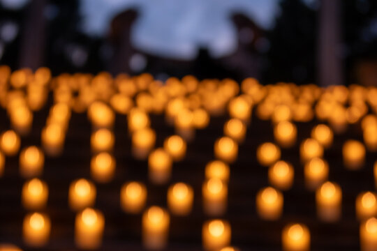 Milan, Italy - July 3, 2024: gardens of Villa Clerici decorated with candles in twilight.