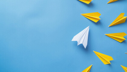 Paper Airplanes on Blue Background. Creative Concept with Yellow Paper Airplanes Following White