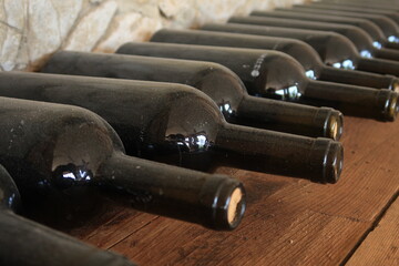 
Wine bottles aging in a Georgian cellar