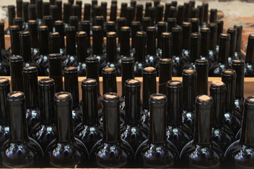 
Wine bottles aging in a Georgian cellar