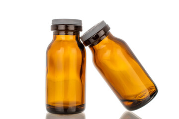 Two glass jars for medicine, macro, isolated on white background.