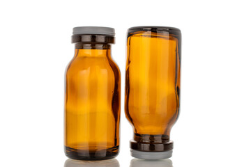 Two glass jars for medicine, macro, isolated on white background.