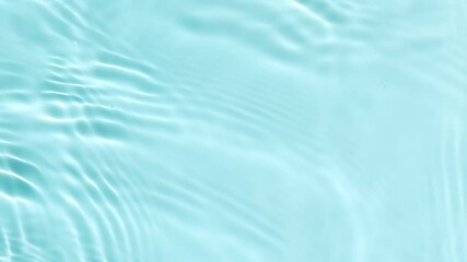 Calming Water Ripples. Close-up view of calming water ripples with gentle light reflections in a light blue pool.