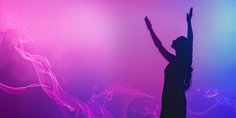 This powerful image captures the essence of Christian worship, showcasing a woman's uplifted hands against a stunning purple and pink backdrop.