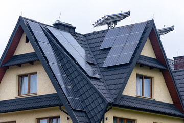 photovoltaic panels on a black metal roof tile