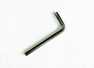 Close up of metal hex L key wrench. Hand tool L Key on white background. Hexagonal  black wrench single L key 