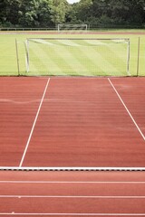 grass football pitch with two goals