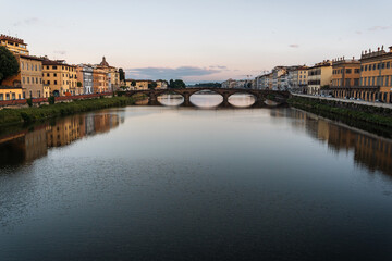 Summer morning in Florence. Ponto Vecchio and the historic center. People go jogging at dawn and there are no tourists.