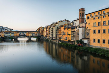 Summer morning in Florence. Ponto Vecchio and the historic center. People go jogging at dawn and there are no tourists.