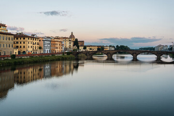 Summer morning in Florence. Ponto Vecchio and the historic center. People go jogging at dawn and there are no tourists.